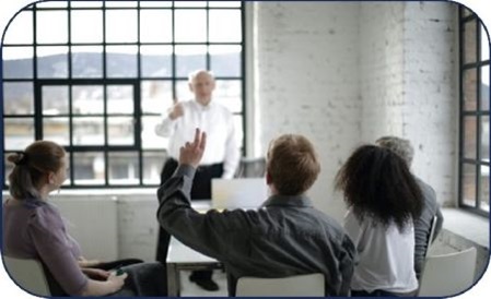 man raising hand during a presentation